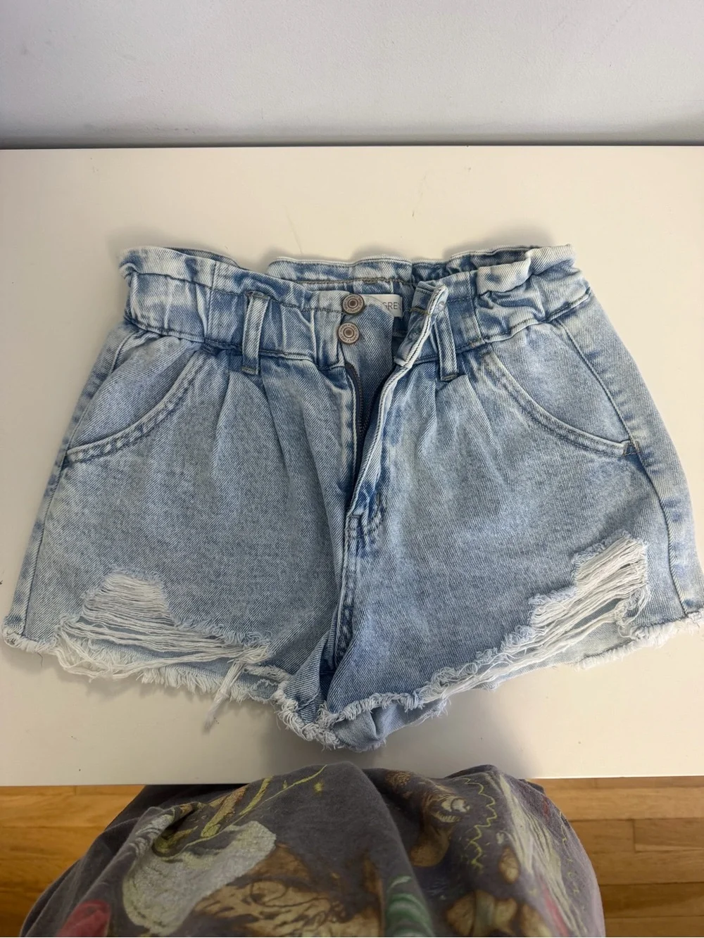High-Rise Light Blue Paperbag Denim Shorts with Distressed Hem